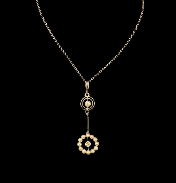 Edwardian natural pearl and diamond garland drop pendant on an integral fine platinum chain.