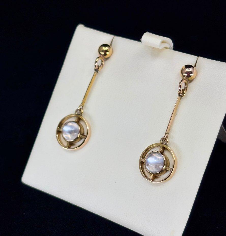 Elegant moonstone drop earrings in 9ct yellow gold, reflecting antique style and craftsmanship from the 1920s.