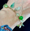 Elegant vintage padlock bracelet featuring jade leaves and chalcedony balls, perfect for collectors.