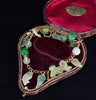 Exquisite jade padlock bracelet from the 1960s made of yellow gold, showcasing intricate jade carvings.