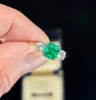 Handmade 1950s emerald and diamond engagement ring showcasing intricate craftsmanship.