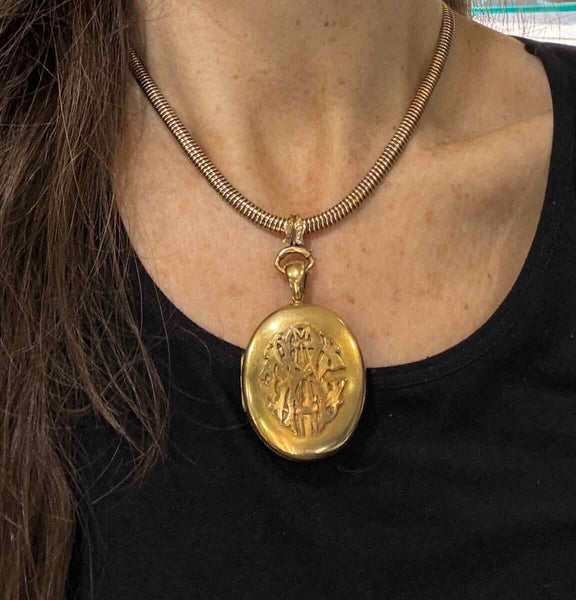 The large scale of the antique 18ct yellow gold locket worn on a collar to show its impressive design