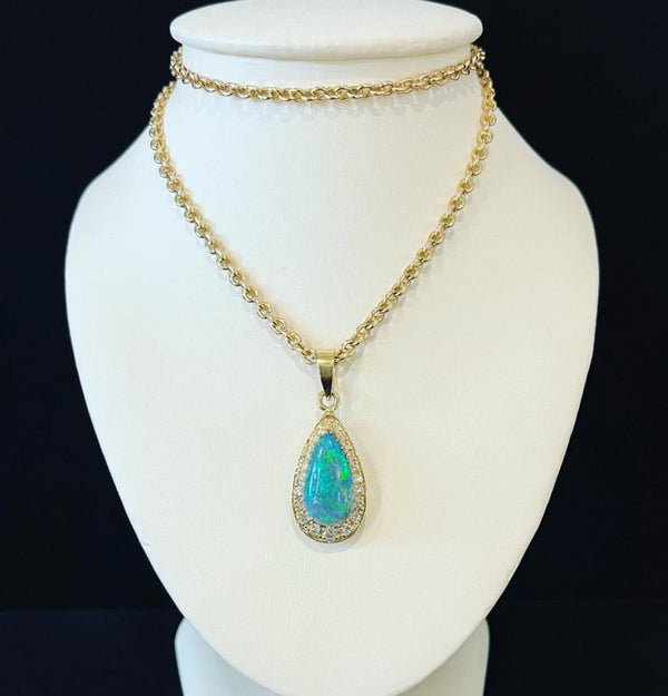 Here is another Lightning Ridge Black Opal, this one is 3.70ct and set with 0.50ct of Diamonds in a 18K yellow pendant.  This pendant is from circa 1970’s, and in this picture we have paired it with our Edwardian 47cm 15K yellow gold chain with a large loop clasp.