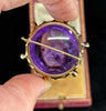 Opulent cabochon amethyst brooch from the Russian Empire era, adorned with diamonds.