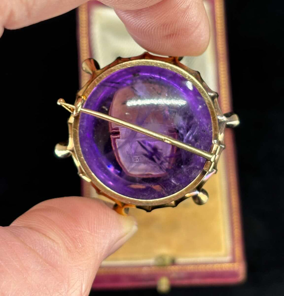 Opulent cabochon amethyst brooch from the Russian Empire era, adorned with diamonds.