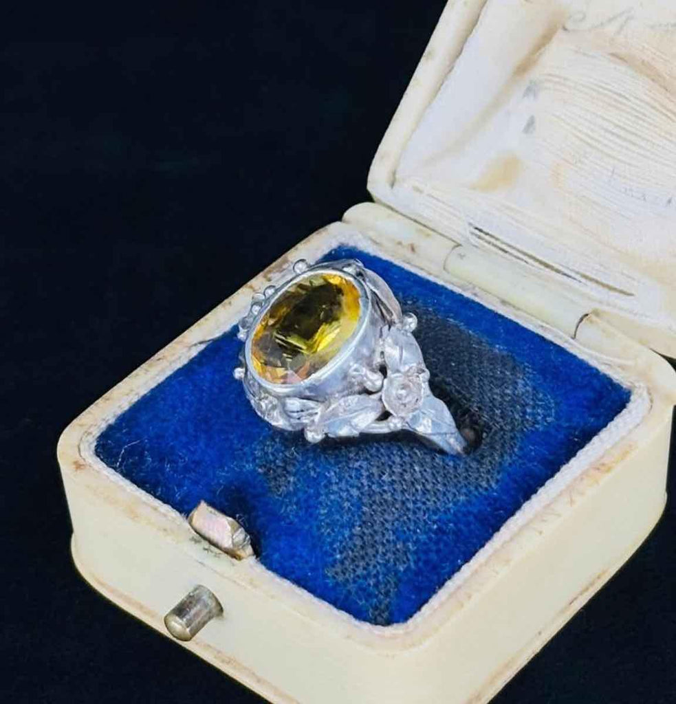 Antique Rhoda Wager silver ring from the 1930s, featuring a beautiful citrine stone and floral embellishments.