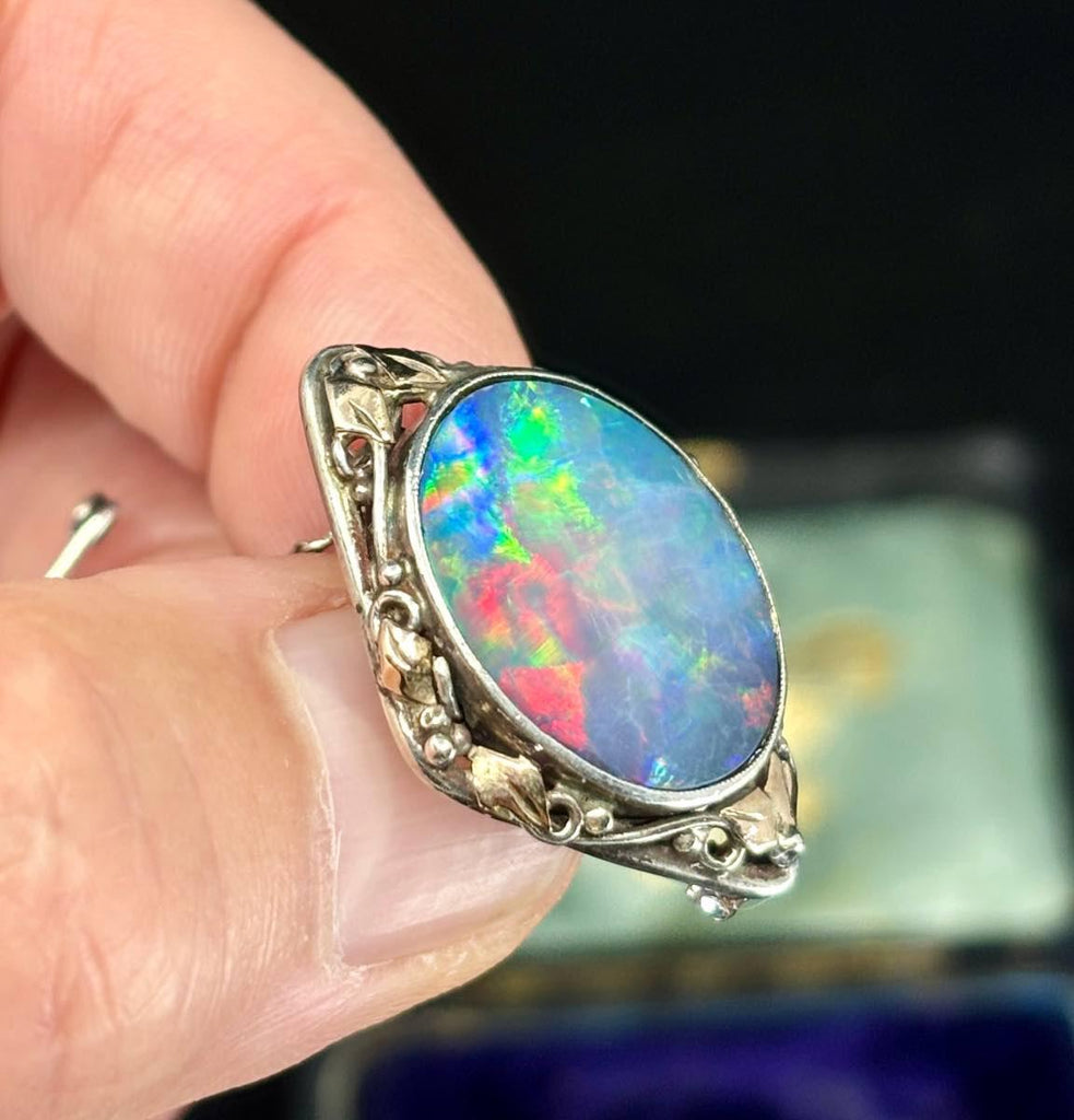 Rhoda Wager Australian opal doublet brooch featuring gold and silver leaf design, showcasing vibrant colours.