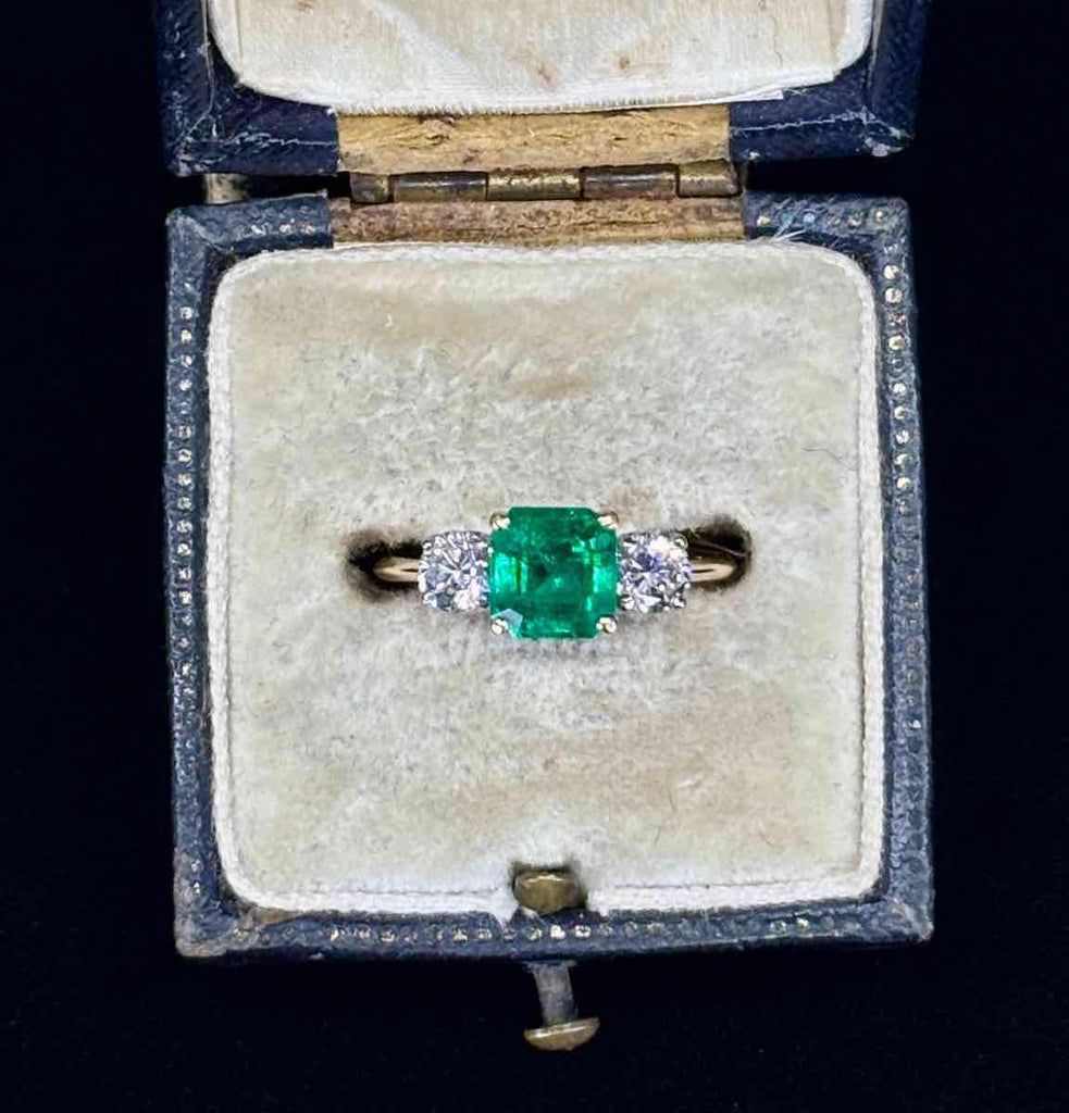 Stunning vintage emerald and diamond ring from the 1950s, handcrafted in elegant design.