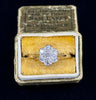 Timeless daisy cluster engagement ring made with antique diamonds, highlighting a classic design and elegant craftsmanship.