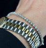 Timeless diamond line bracelet with 65 brilliant cut stones set in white gold.