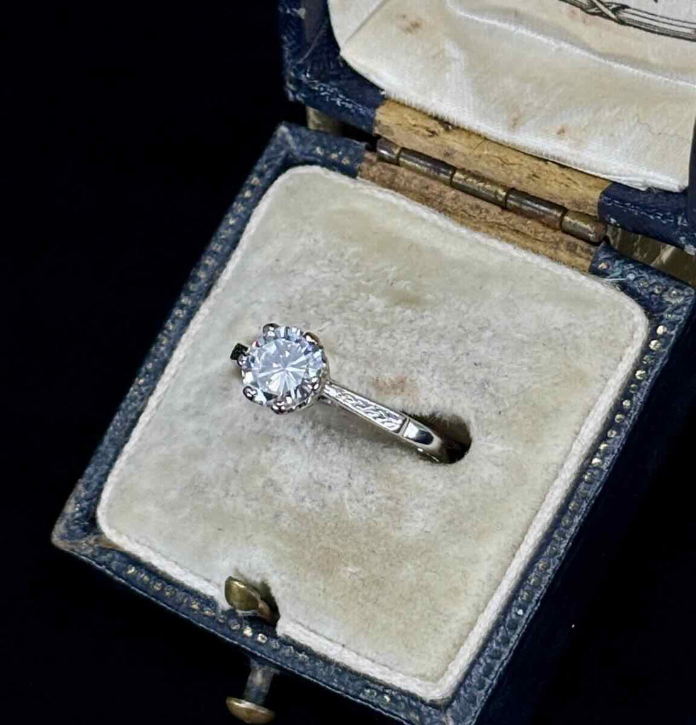 A side view of a timeless diamond solitaire  engagement ring