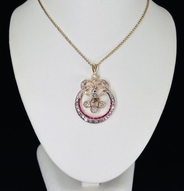 Timeless Victorian diamond pendant in 12ct gold featuring an eternity knot.