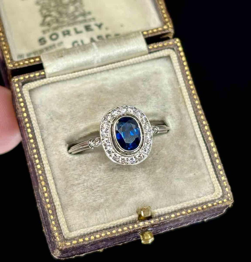 Unique Oval Cluster Engagement Ring from the 1950s Featuring Sapphire and Diamonds.