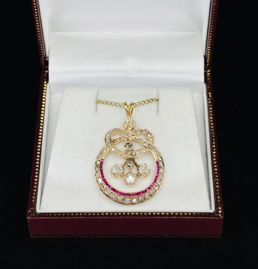 Victorian eternity knot diamond pendant featuring rose cut diamonds set in 12ct gold.