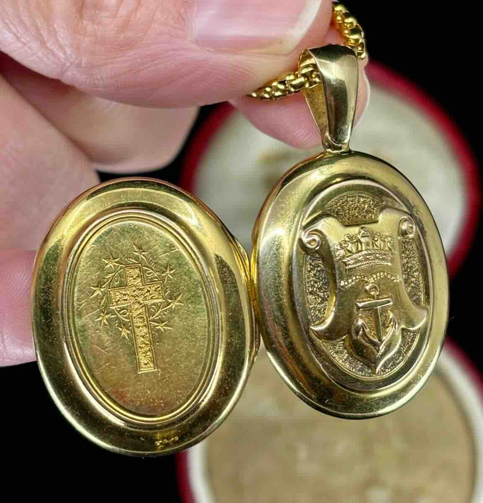 Close up of handcrafted detailing on Victorian locket showing crown and anchor relief in 15ct yellow gold — antique locket craftsmanship