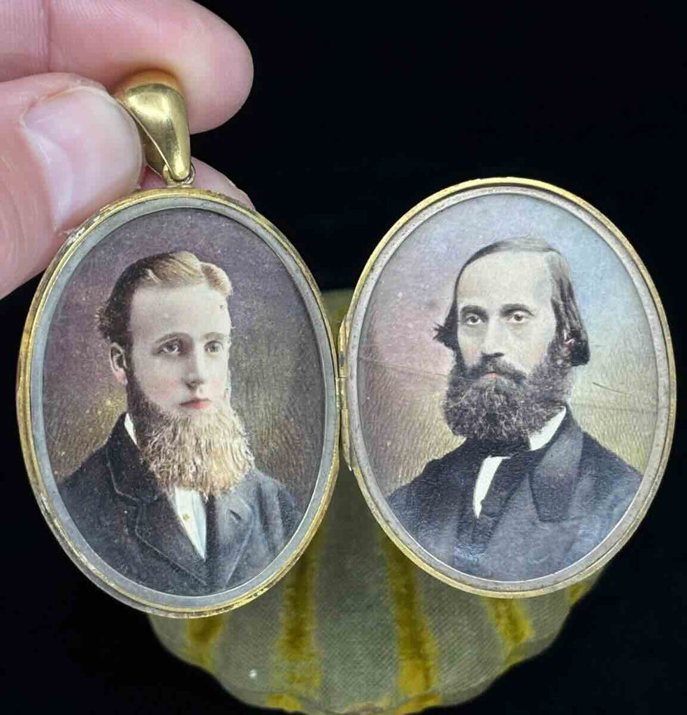 A daguerreotype of Two gentlemen, painted with precision and held securely behind the locket with the original glass.