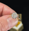 Vintage diamond cluster ring from the 1920s, showcasing an Art Deco style with a beautiful arrangement of diamonds resembling a daisy.