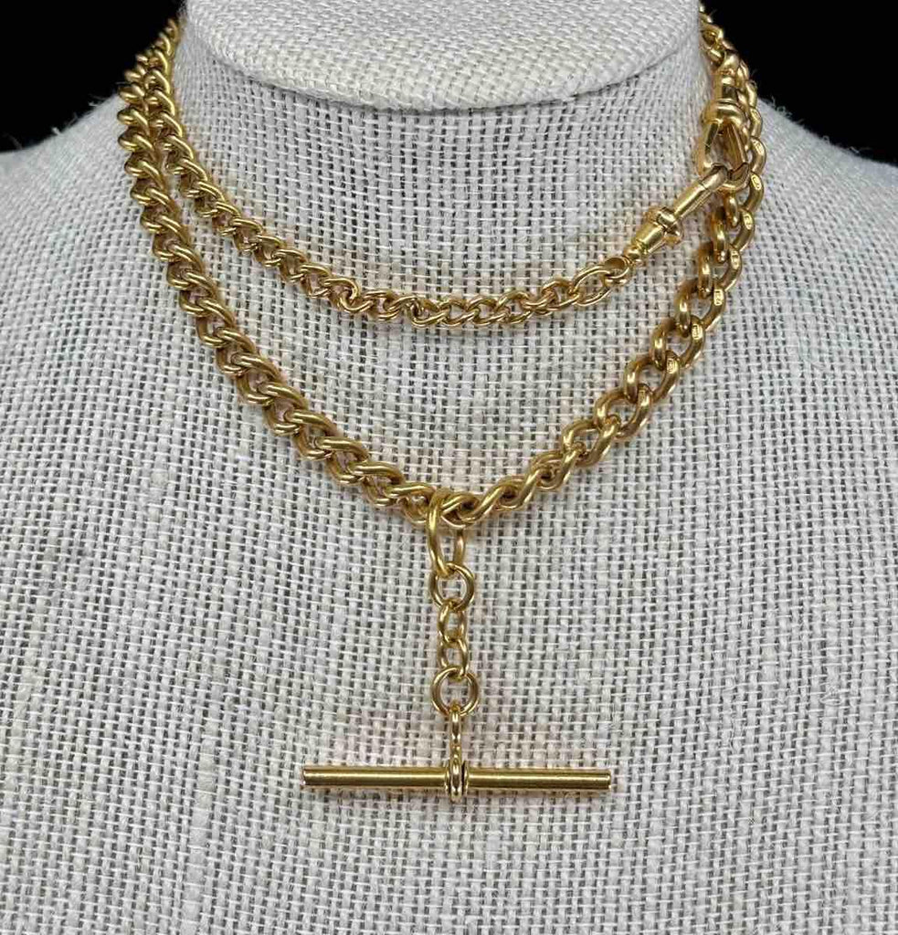 Vintage Edwardian Albert chain made from 18k gold, highlighting timeless sophistication.