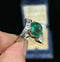 Vintage inspired ring featuring a 3.25 carat untreated emerald with diamonds