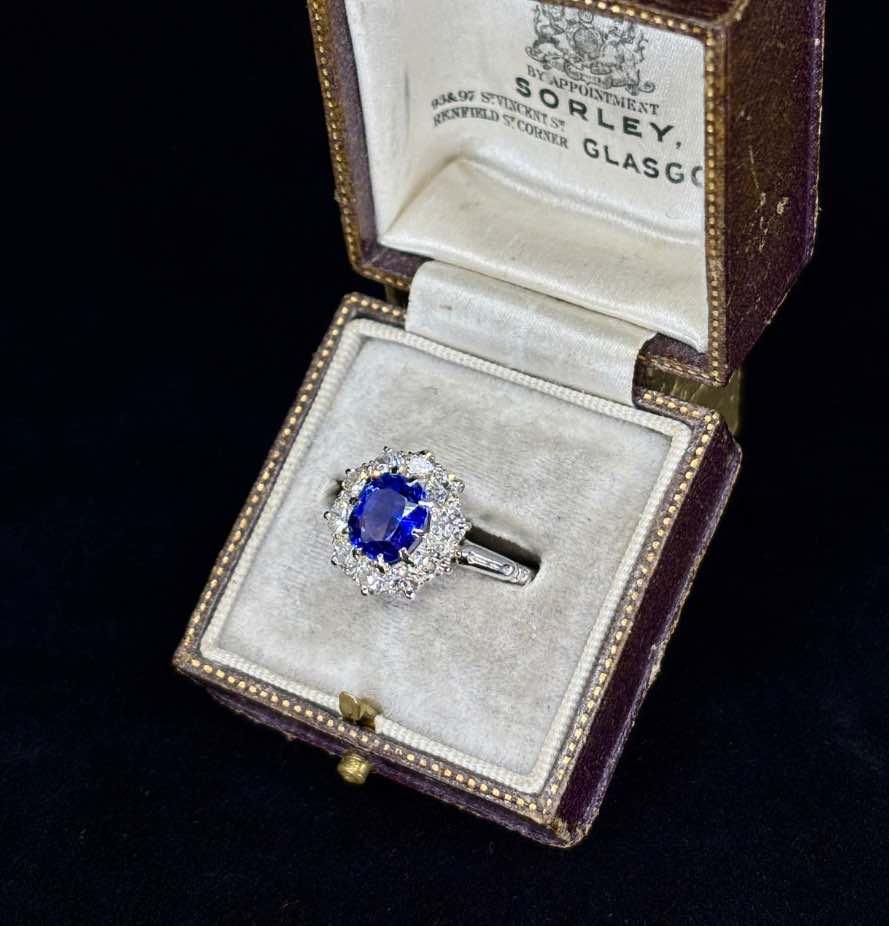 Vintage platinum ring with a cushion cut Ceylon sapphire and European cut diamonds.