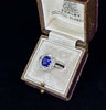 Vintage platinum ring with a cushion cut Ceylon sapphire and European cut diamonds.