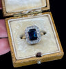 Vintage 1930s sapphire and diamond ring showcasing Art Deco influences with geometric design elements.