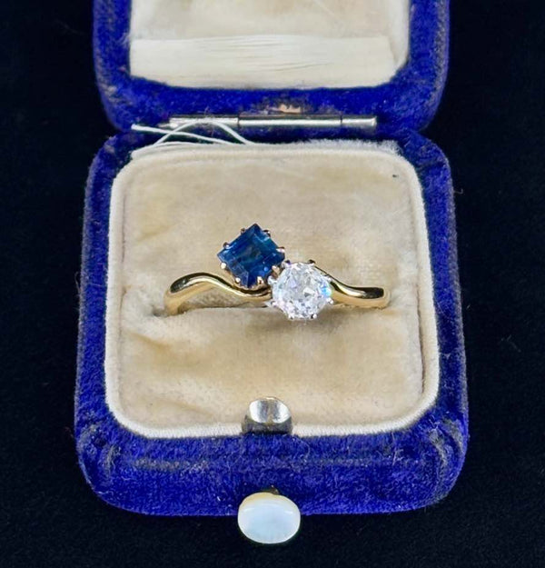 Elegant vintage ring with square-cut sapphire and old-cut diamond.