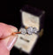 Side view of a vintage three stone diamond ring from the 1920s.