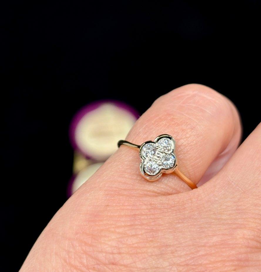 A unique and collectible quatrefoil diamond ring, perfect for lovers of antique and vintage jewelry.