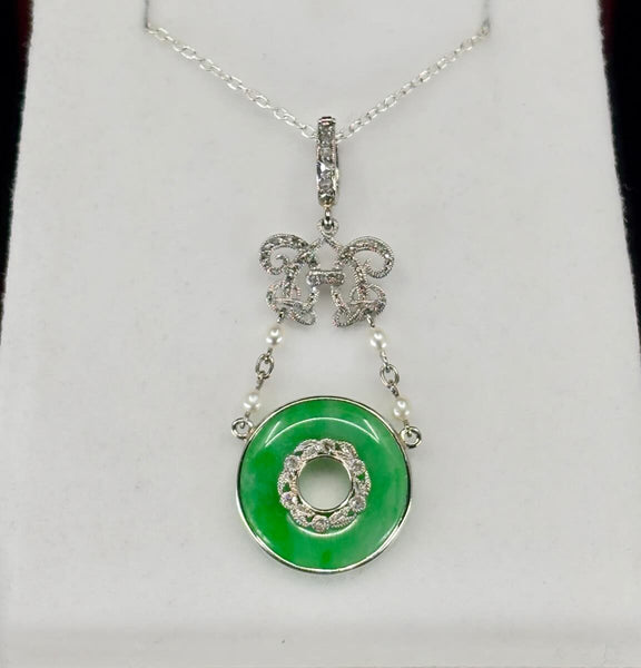 A‑type jadeite pendant in platinum, untreated natural jadeite pi disc set with rose‑cut diamonds — circa 1900