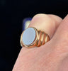 Antique 15ct yellow gold sardonyx signet ring worn on the pinky finger