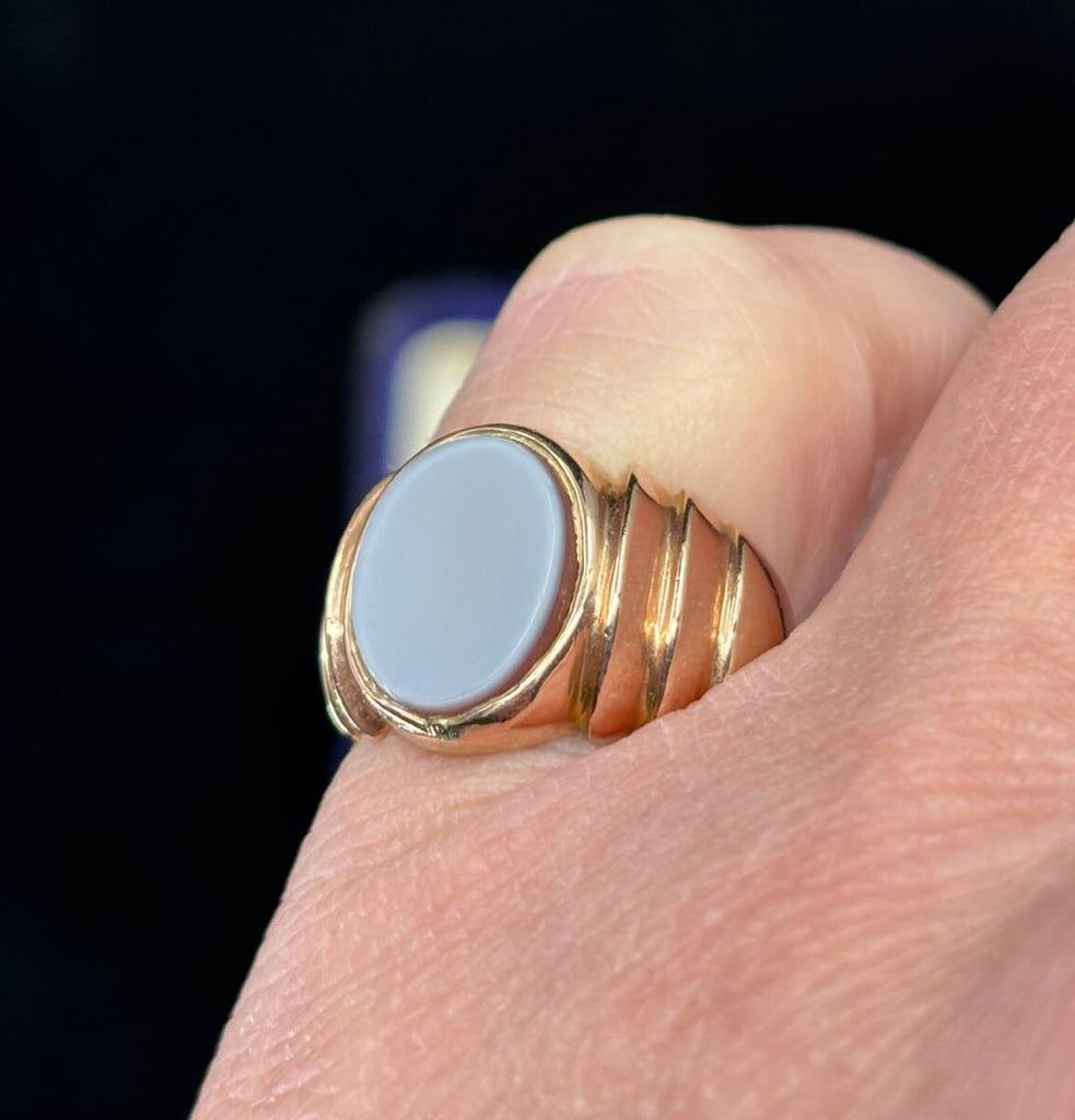 Antique 15ct yellow gold sardonyx signet ring worn on the pinky finger