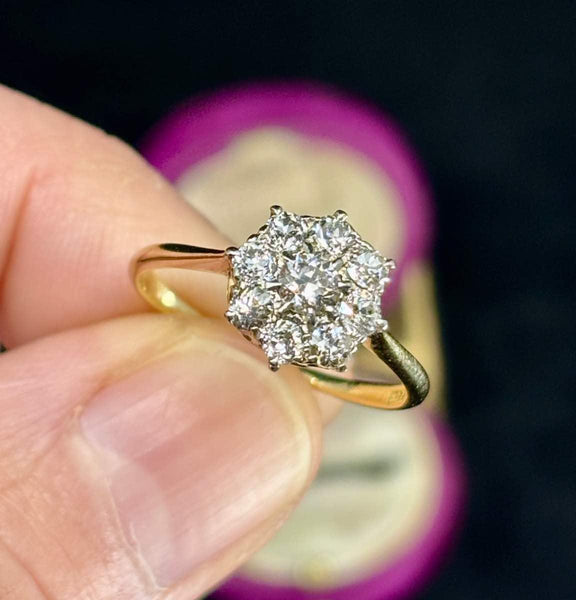 A close up of the very elegant 1930s antique diamond flower cluster ring
