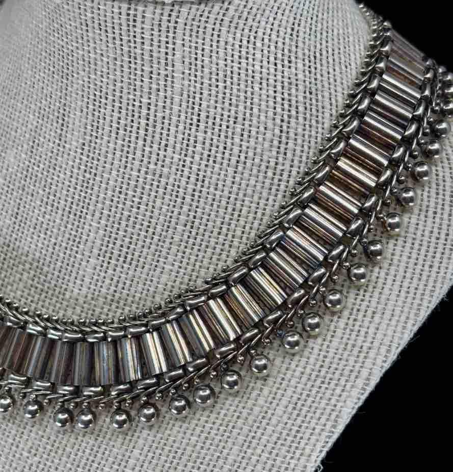 Victorian Sterling silver collar necklace displayed on a mannequin, emphasising its elegant and timeless design.