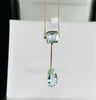 Antique Edwardian aquamarine drop pendant with emerald cut top stone and pear shaped aquamarine in 9ct yellow gold