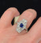 Antique Art Deco ring from the 1930s with a royal blue sapphire and dazzling old cut diamonds in a classic tonneau shape.