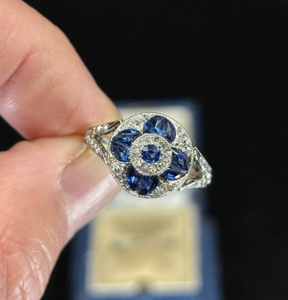 art deco sapphire and diamond cluster ring up close featuring the fancy cut Ceylon sapphires.