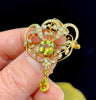 Antique Art Nouveau 9ct gold brooch with green garnet drop pendant and natural half pearls in ornate gold setting.