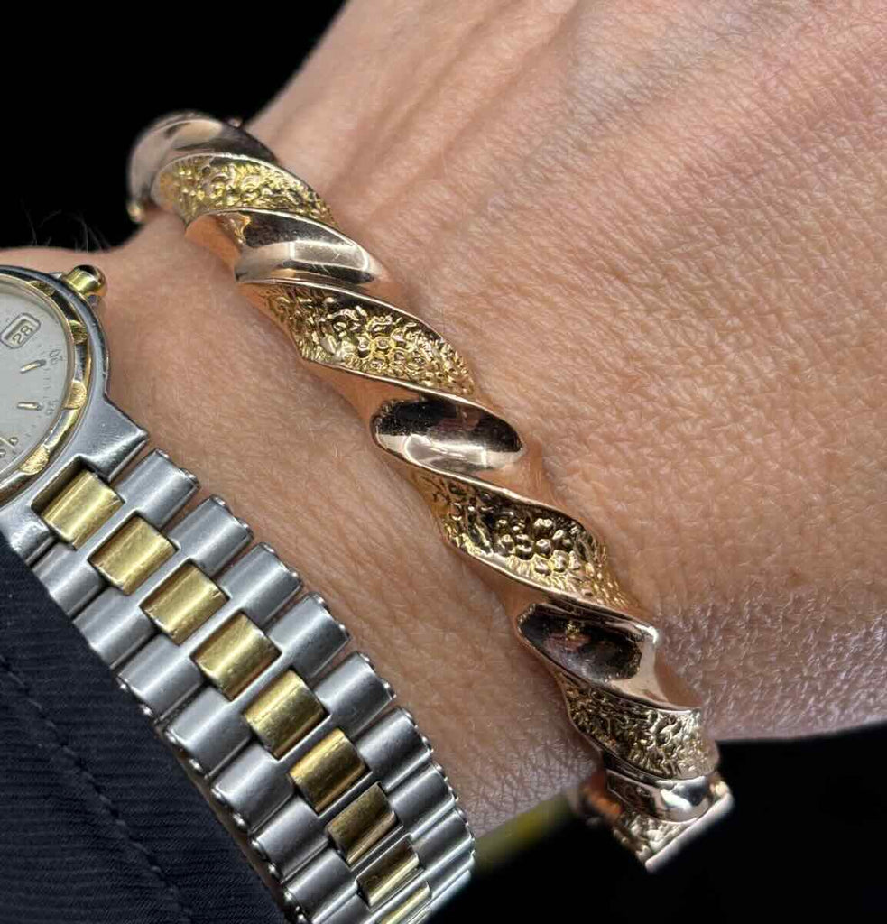 Antique Australian 9ct gold bangle with twisted rope motif and alternating plain and repoussé floral surfaces, 8mm wide, antique Willis & Co piece.