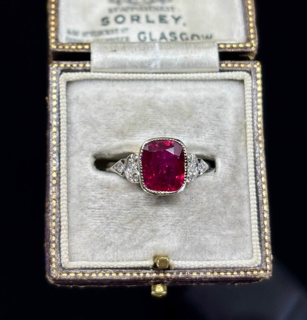 Antique cushion ruby ring in 18ct white gold and platinum, rich deep red 2.83ct ruby of Thai origin (GSL certified) with decorative gallery and shoulders.