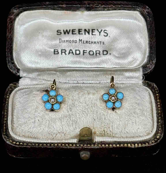 Pair of antique daisy cluster earrings with turquoise and pearls in an antique earring box.