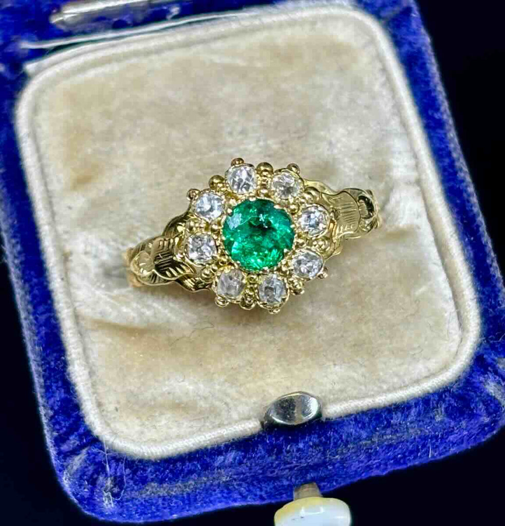 Antique Victorian ring with fine green emerald and diamonds set in gold.