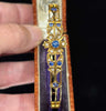 Antique gold bangle with cornflower-blue sapphires and old-cut diamonds, Victorian Australian jewellery.