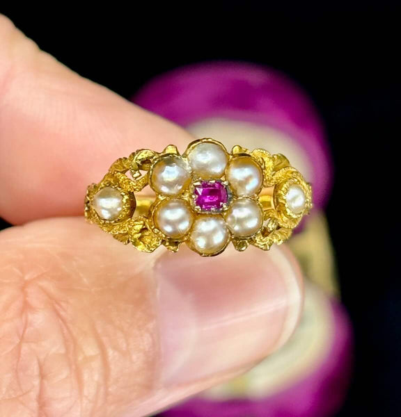 Antique gold ring with ruby and pearls set in the shape of a flower cluster from the 1840s.