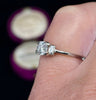 Antique Hardy Brothers engagement ring with central diamond and baguette shoulder stones.