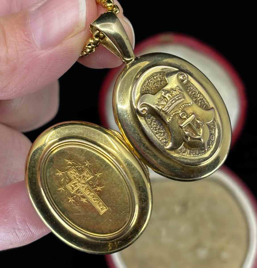 Antique locket featuring a raised crown and anchor motif within a heraldic banner, 15ct yellow gold Victorian pendant