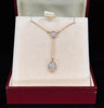 antique opal pendant necklace displayed in a luxurious box, highlighting two exquisite Lightning Ridge opals in a fine, delicate gold setting.
