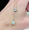 antique opal pendant necklace from the Edwardian era, showcasing a refined and elegant oval pendant drop set in fine 9ct yellpw gold
