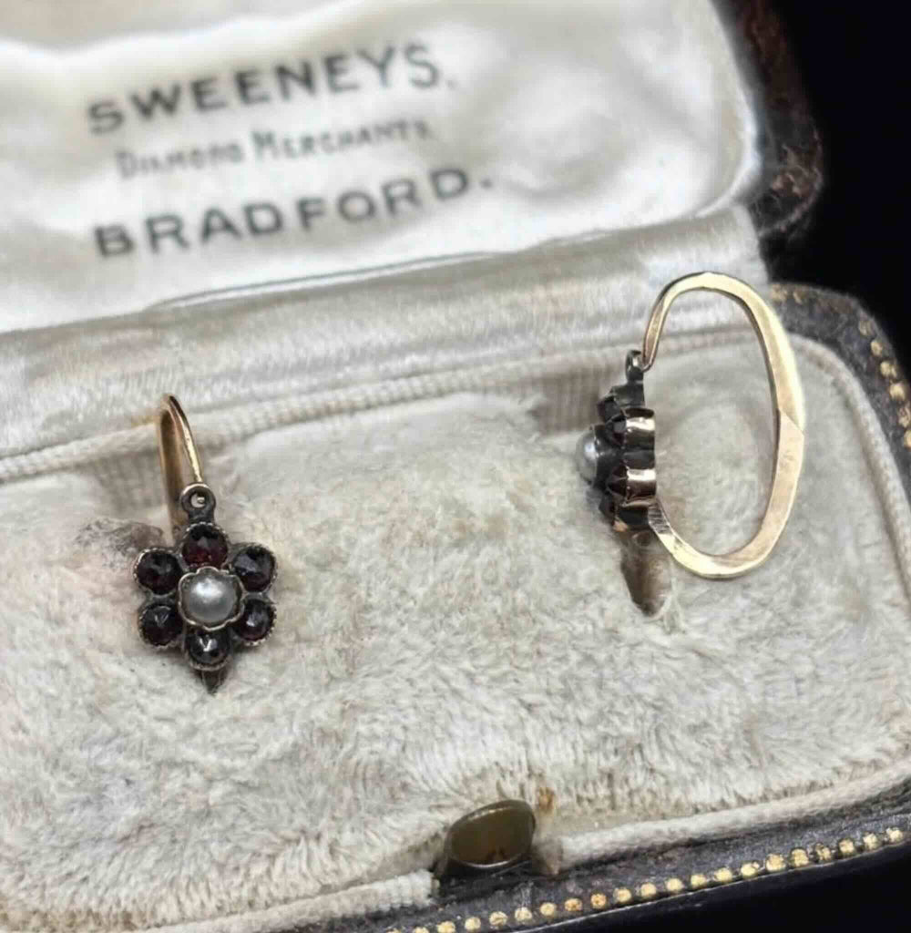 Antique daisy cluster earring turned to show the hinged lever-back fitting
