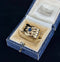 Elegant late Victorian sapphire snake ring with a 4.2 x 4.0mm cushion cut sapphire and intricate design in yellow gold.